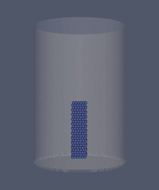 Granular material falling into a bucket, color coded by speed